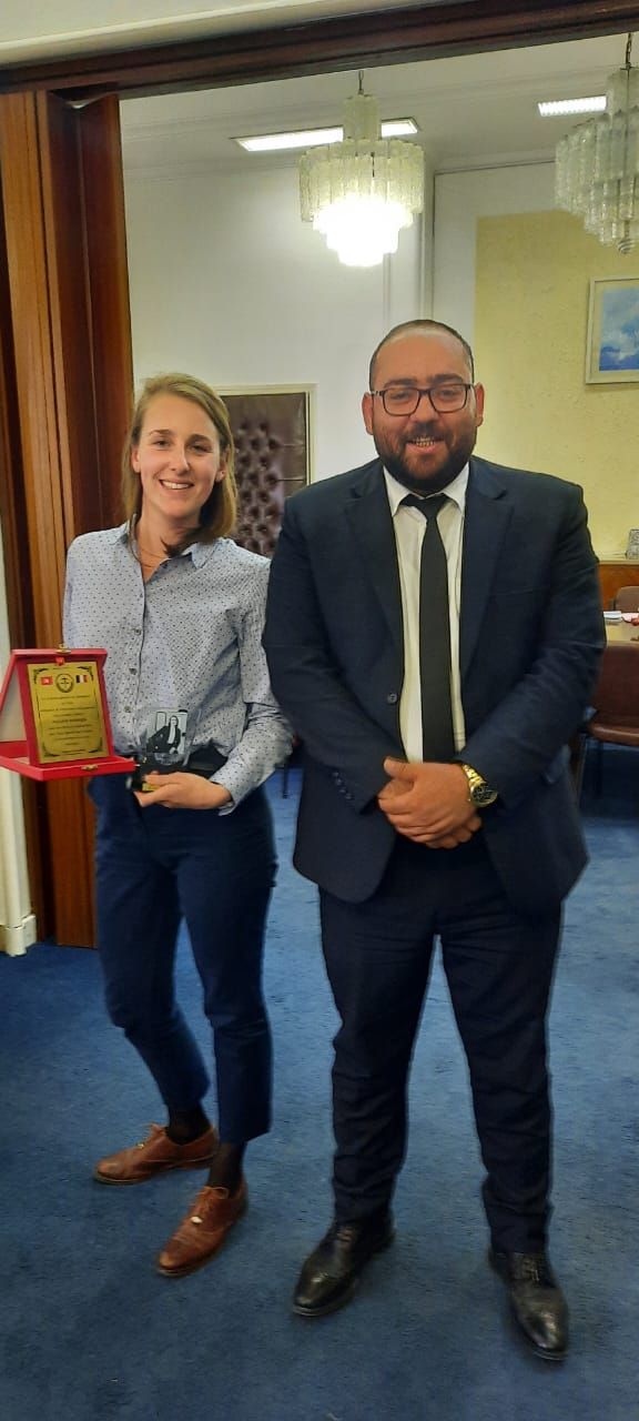 Pauline Hoerner presented with a plaque from the Tunisian State Department of Litigation